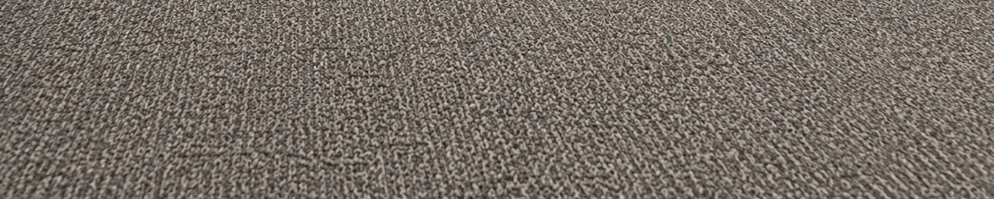 Nahaufnahme eines grauen Teppichbodens aus Schlingenware in einem Bürogebäude